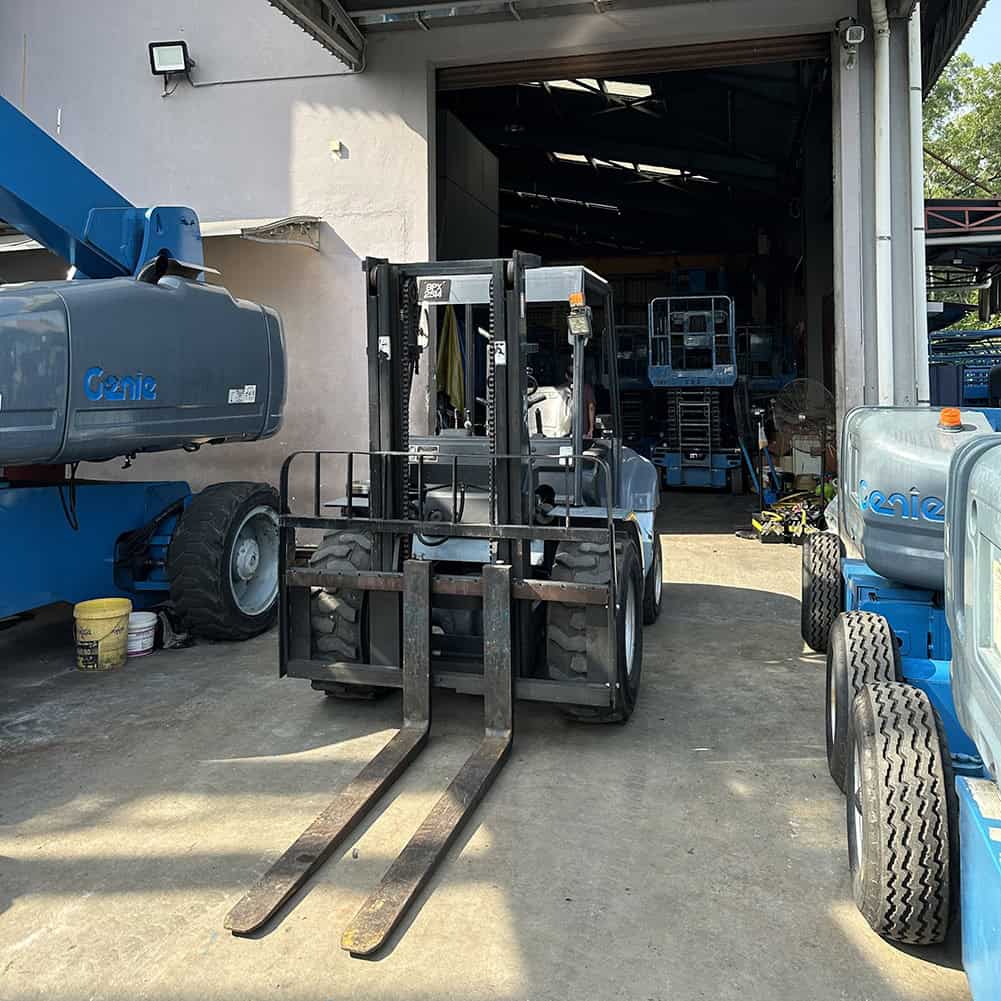 Industrial forklift for material handling parked in a depot.